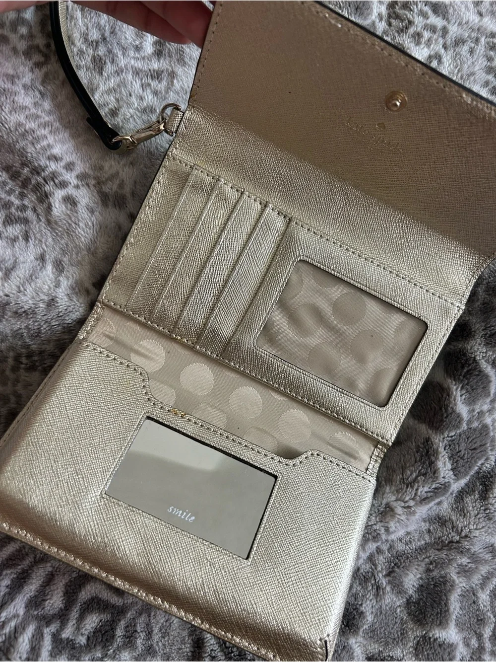 kate spade metallic gold wristlet clutch with black strap